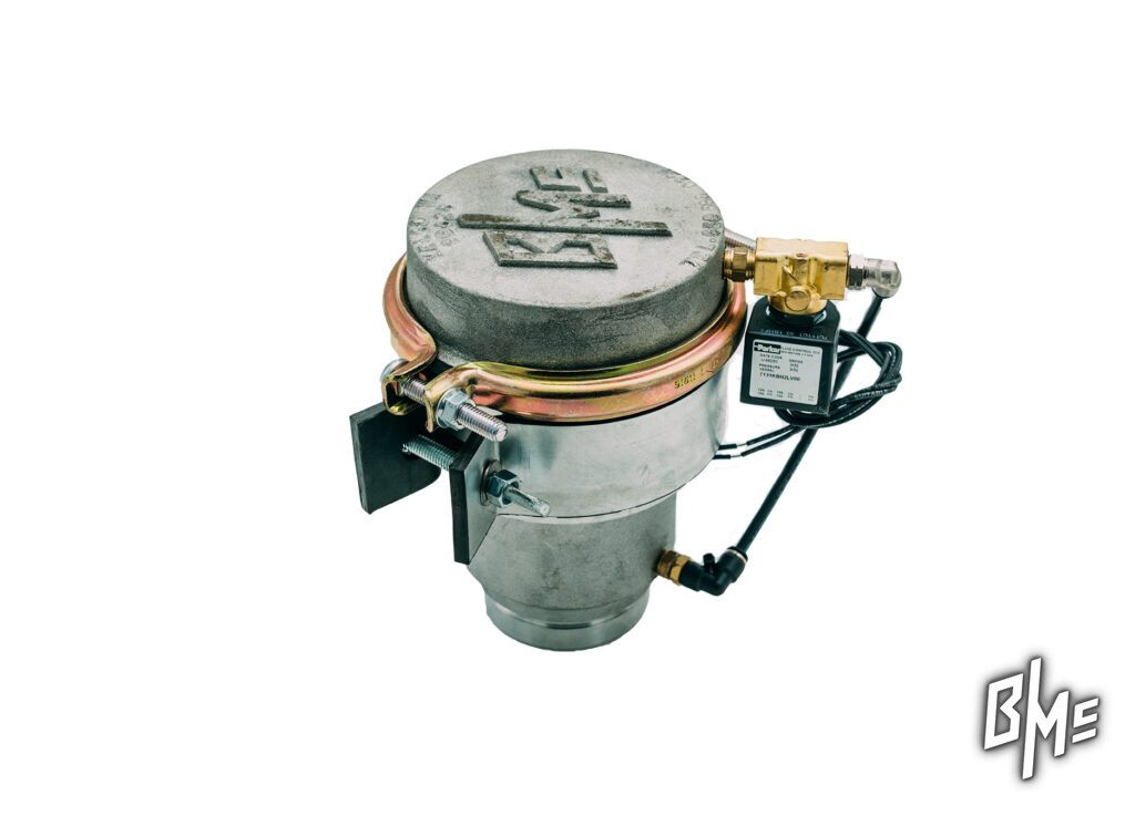 B/Mc water truck spray valve on a white background, showing the cast lid, banded clamp and grooved inlet