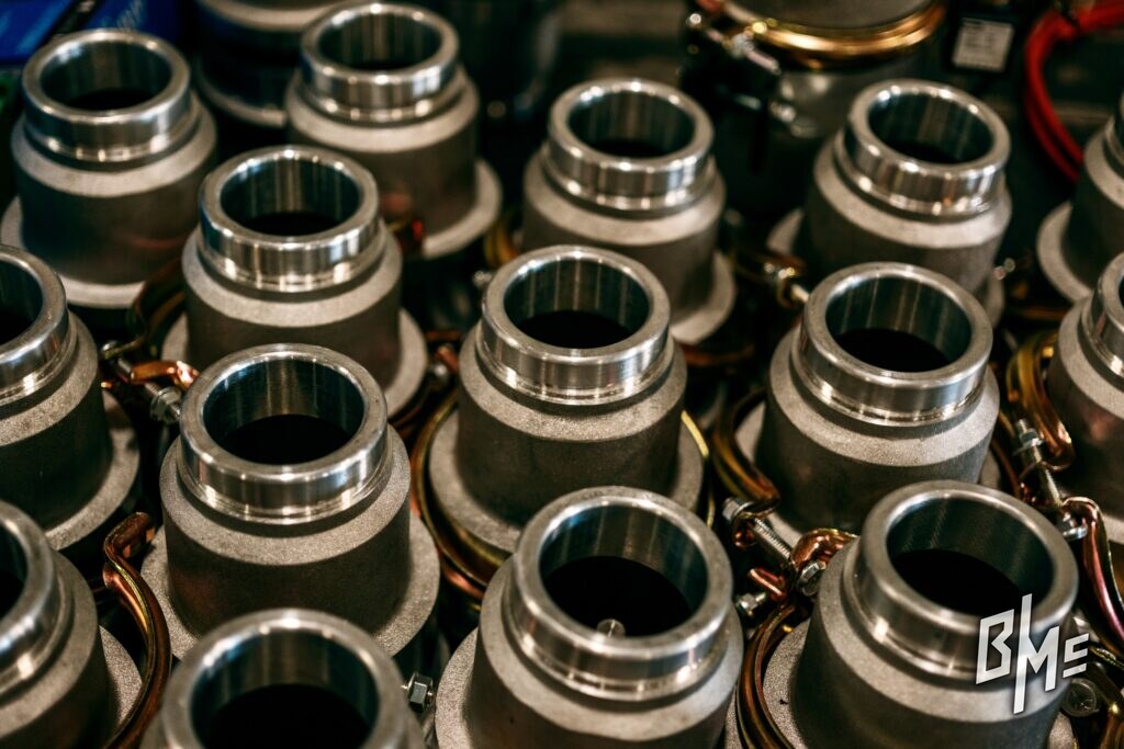 Close view of rows of machined grooved couplings