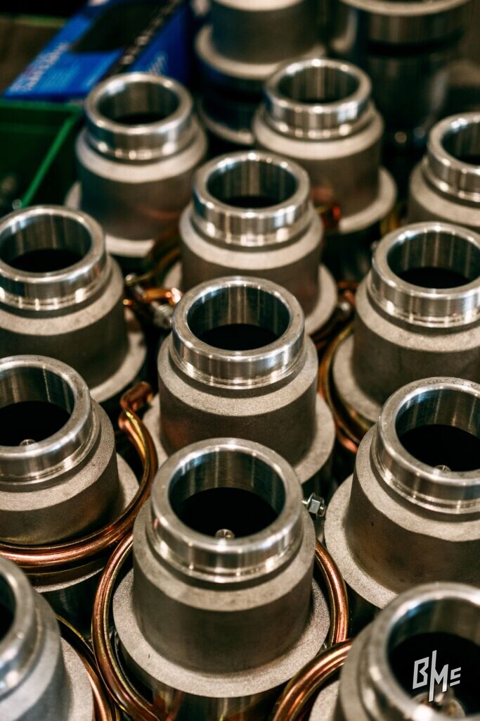 Rows of grooved spray valve inlets seen from above