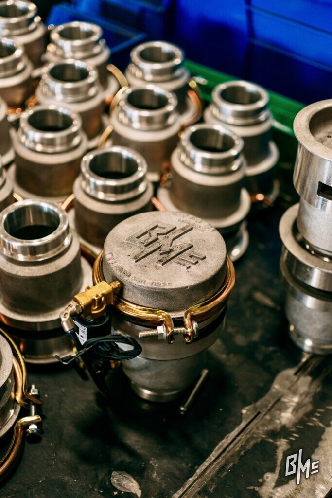 Assembled B/Mc spray valves with the cast B/Mc mark visible on the lid
