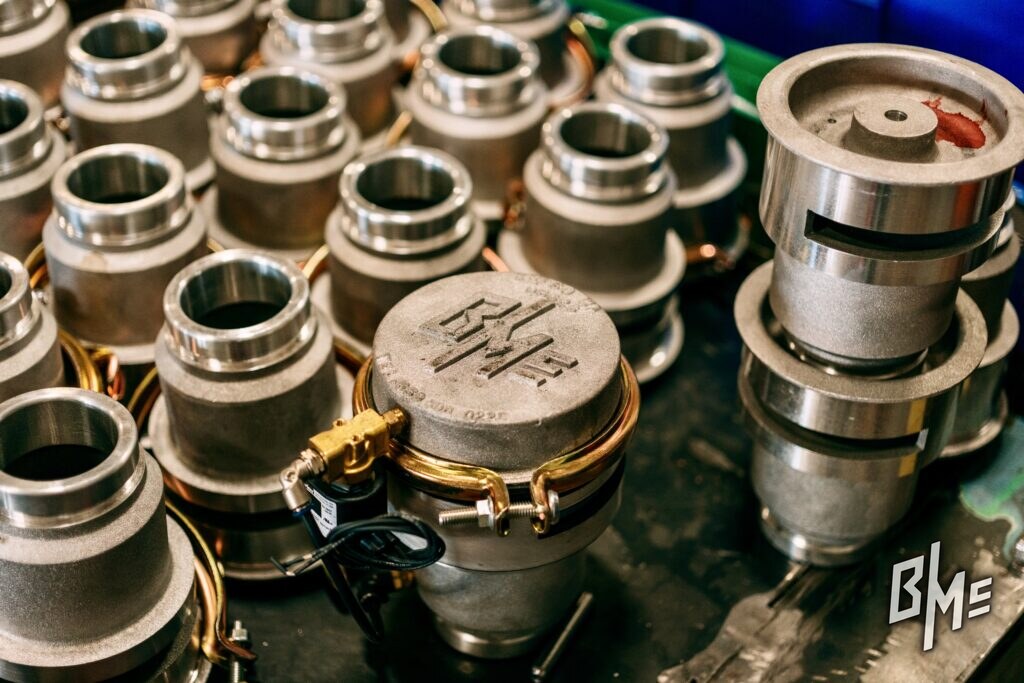 Cast B/Mc lid among a batch of grooved valve inlets