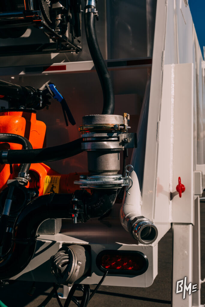 Spray valve and hose routing on a water truck