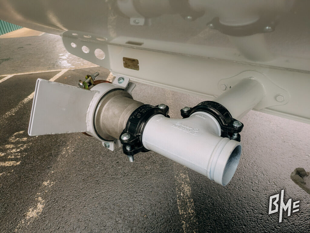 Underside view of a spray head and delivery pipe on a tanker