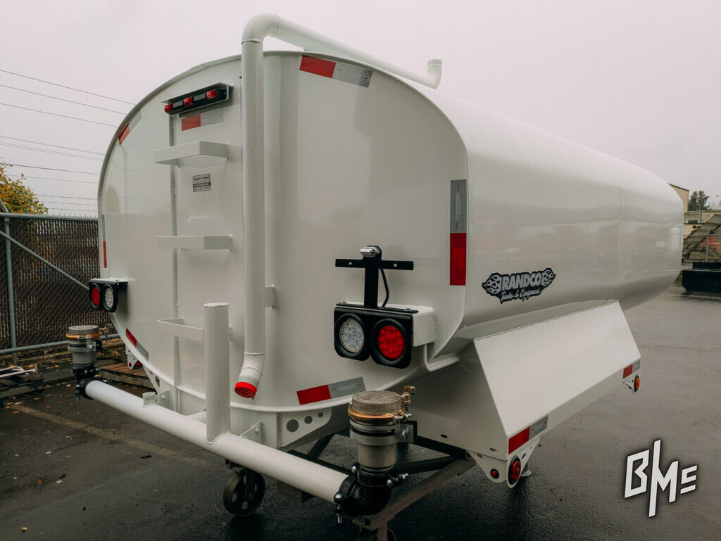 White tanker trailer with rear spray equipment fitted